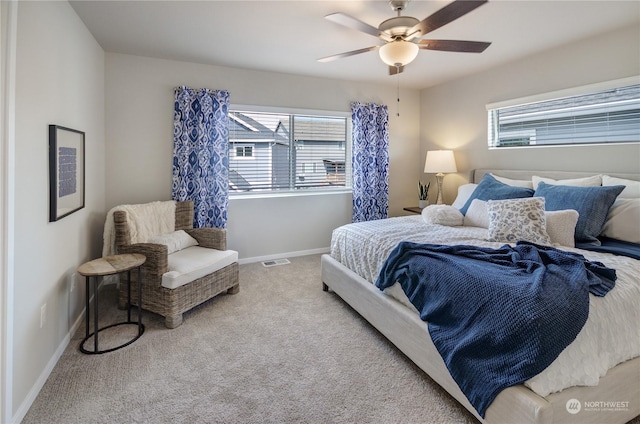 bedroom featuring light carpet and ceiling fan