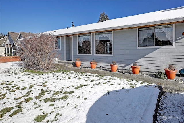 view of snow covered house