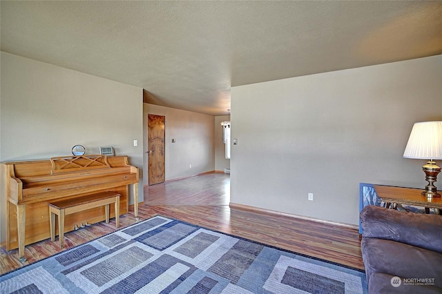 sitting room featuring hardwood / wood-style floors and a textured ceiling