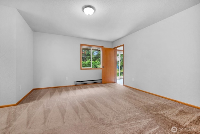 unfurnished room with carpet, baseboards, and a baseboard radiator