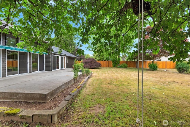 view of yard featuring a patio and a fenced backyard