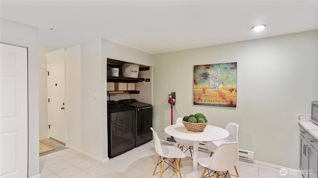 dining area with baseboards and washer and dryer