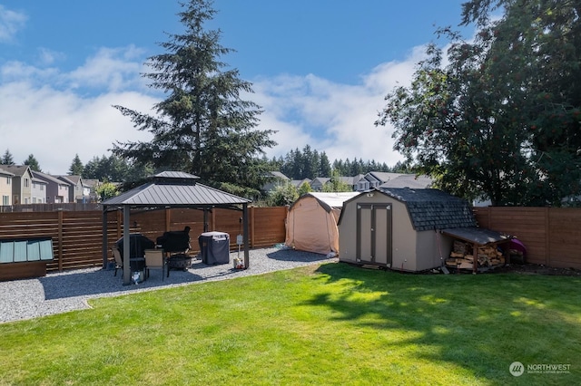 view of yard with a gazebo and a shed