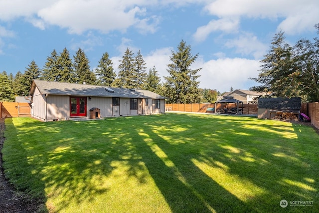 exterior space featuring a gazebo and french doors