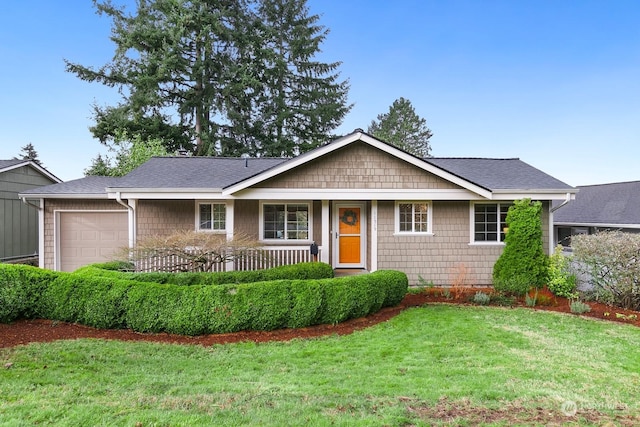 single story home featuring a garage and a front yard