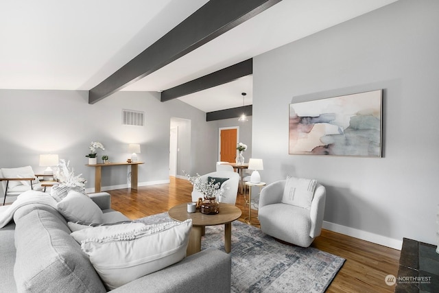 living room with vaulted ceiling with beams and dark hardwood / wood-style floors