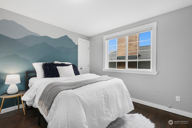 bedroom with dark wood-type flooring