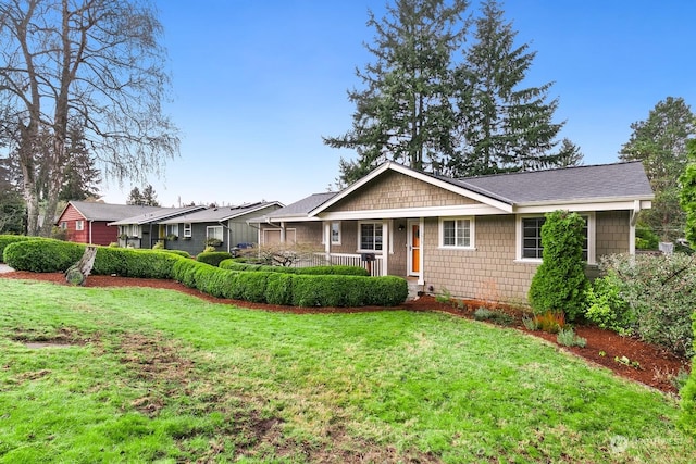 ranch-style home with a porch and a front lawn