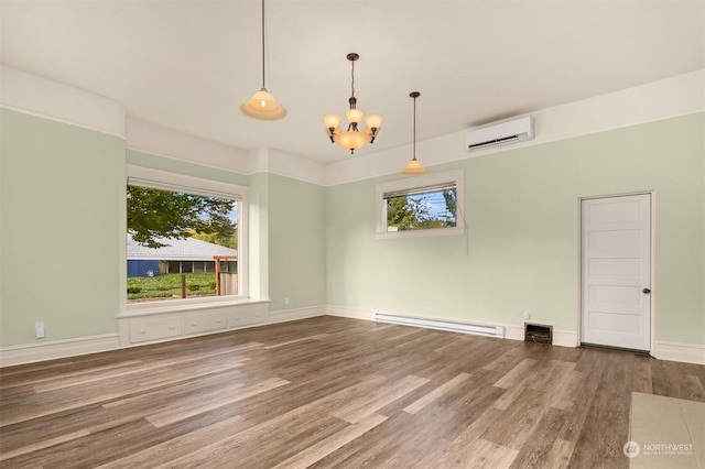 unfurnished dining area featuring baseboard heating, plenty of natural light, a wall unit AC, and hardwood / wood-style flooring