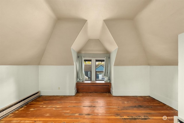 bonus room with a baseboard radiator, wood-type flooring, and vaulted ceiling