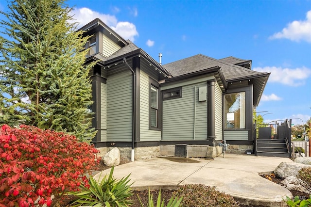 rear view of property featuring a patio area