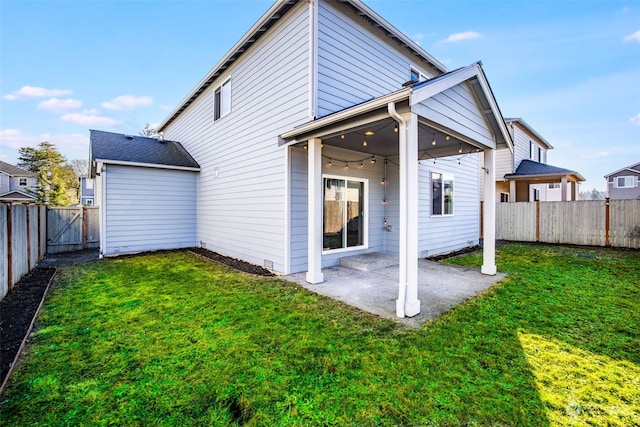 rear view of house featuring a lawn, a patio, and ceiling fan