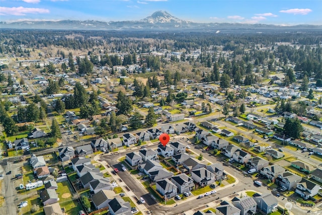 birds eye view of property with a mountain view