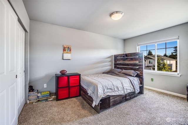 carpeted bedroom featuring a closet