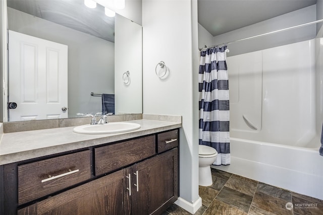 full bathroom with vanity, shower / bath combination with curtain, and toilet