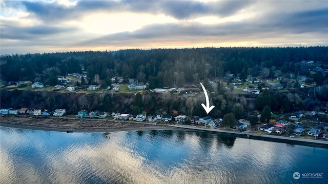 aerial view at dusk with a water view