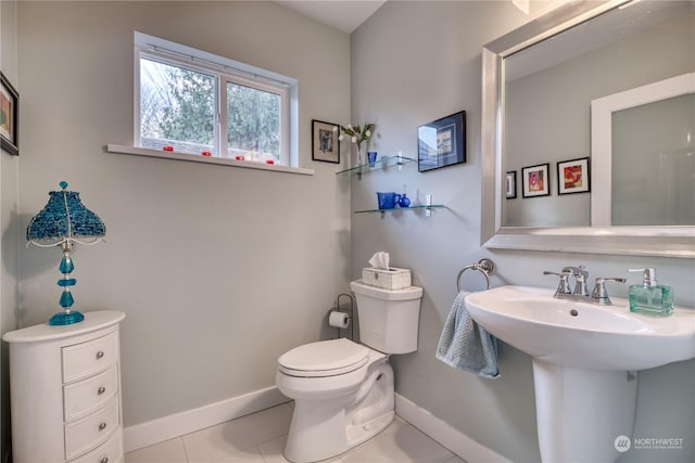 bathroom featuring tile patterned flooring, sink, and toilet