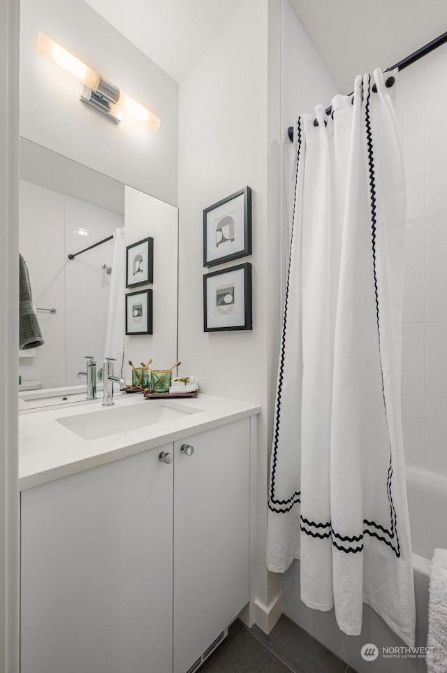 bathroom featuring vanity and shower / bath combo with shower curtain