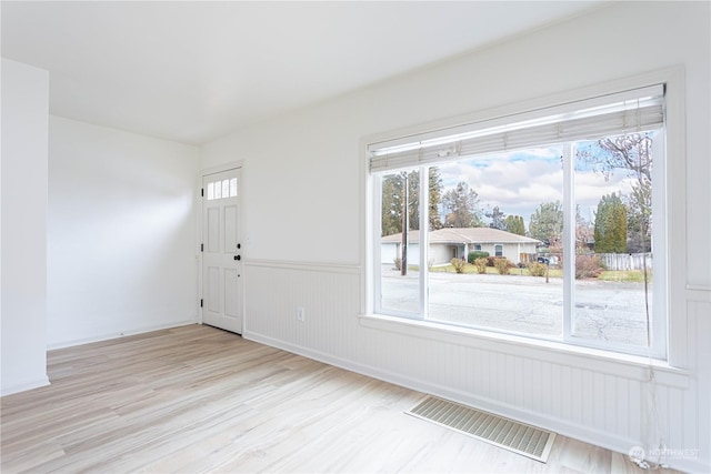 unfurnished room featuring light hardwood / wood-style flooring