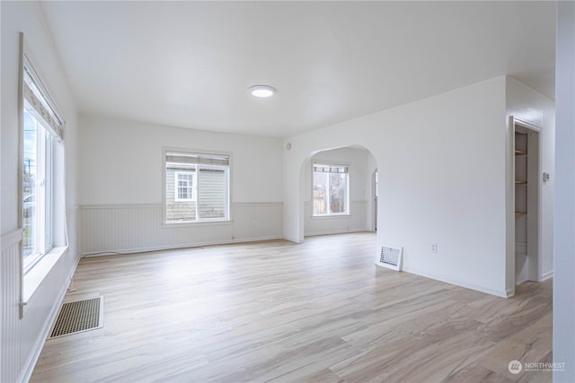 unfurnished room with light hardwood / wood-style flooring