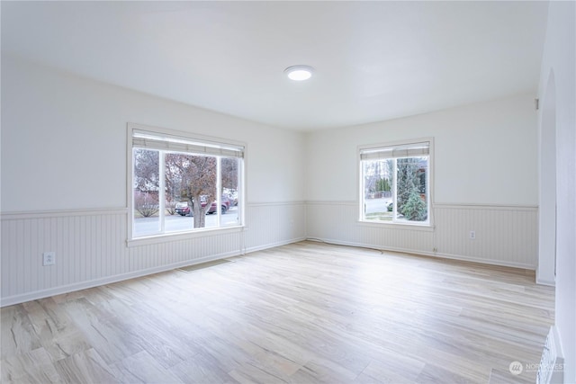 unfurnished room featuring light hardwood / wood-style floors