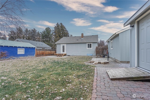 exterior space featuring a patio and an outbuilding