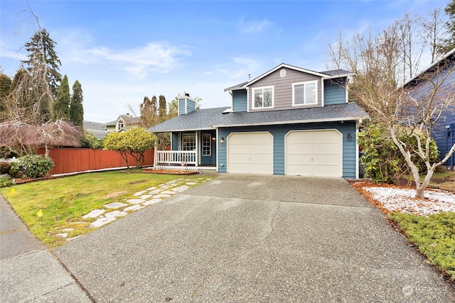 view of front of home featuring a garage, a front lawn, and a porch