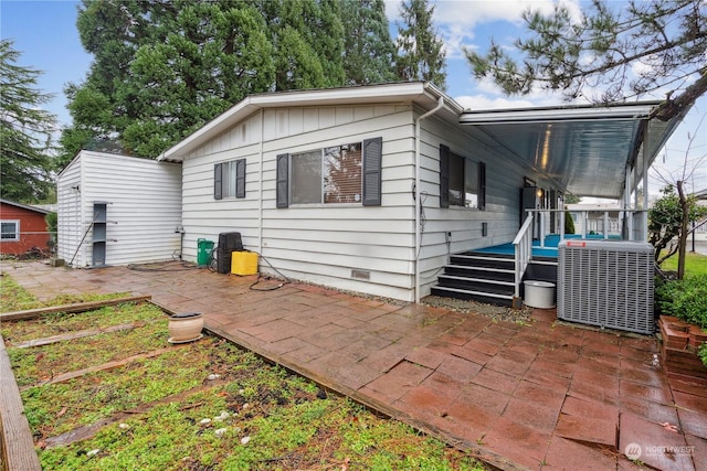 back of house with a patio, cooling unit, and a deck