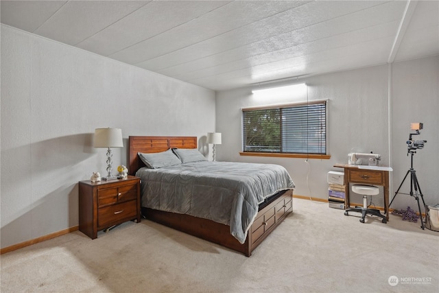 bedroom featuring light colored carpet