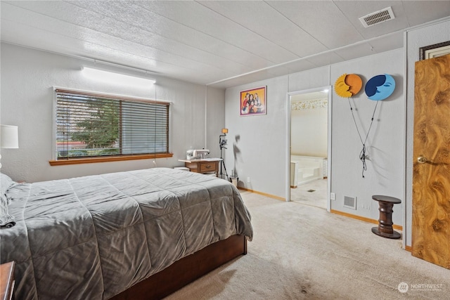 bedroom featuring light carpet