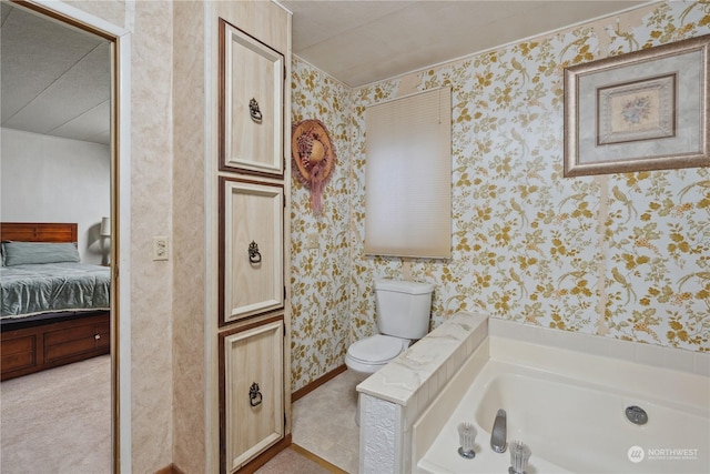 bathroom featuring a washtub and toilet