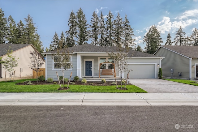 ranch-style home with a garage, a front lawn, and a porch