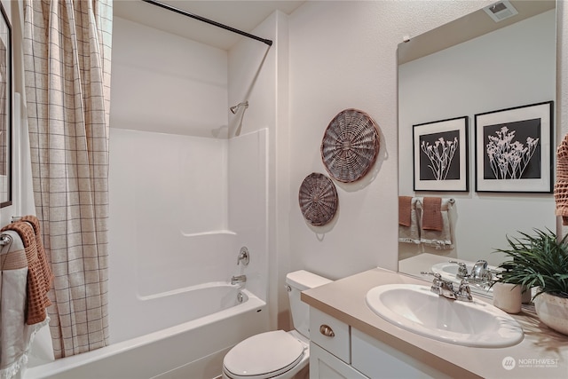 full bathroom featuring vanity, shower / bath combination with curtain, and toilet