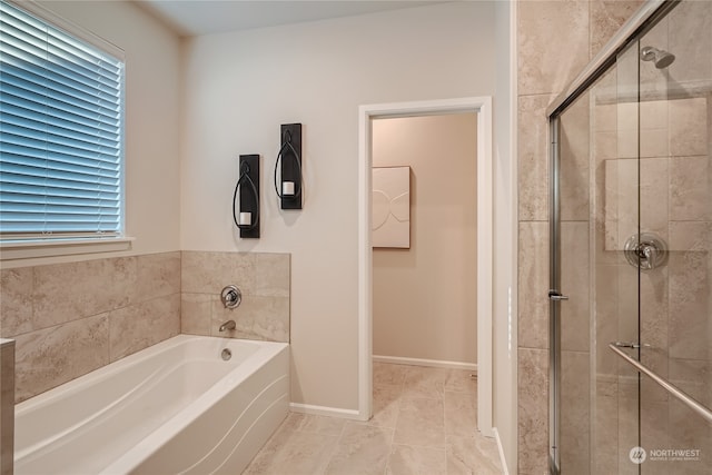 bathroom with separate shower and tub