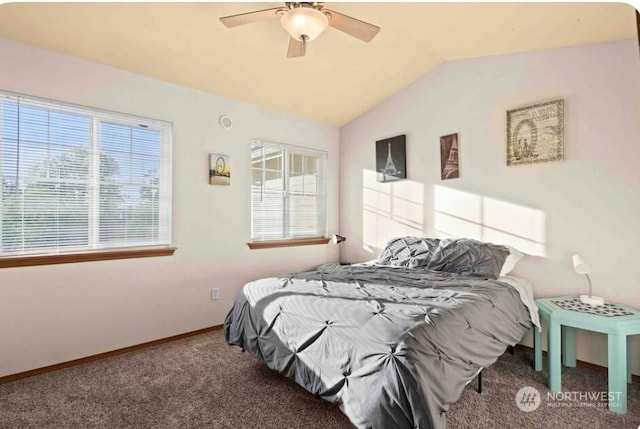 carpeted bedroom featuring vaulted ceiling and ceiling fan