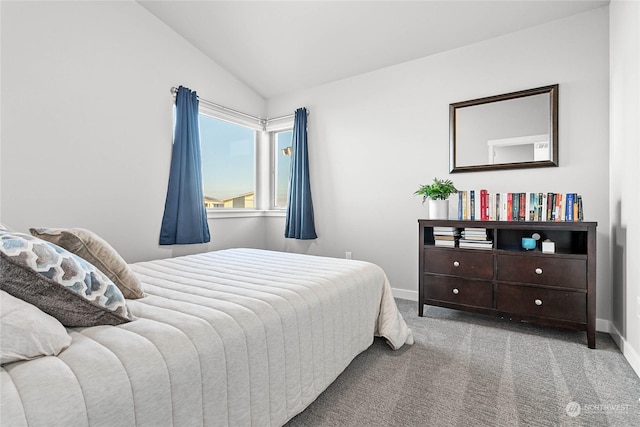 bedroom featuring lofted ceiling and carpet flooring