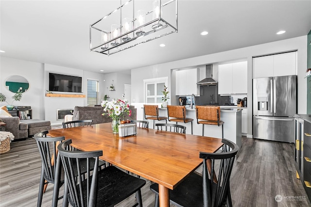 dining room featuring hardwood / wood-style flooring and sink