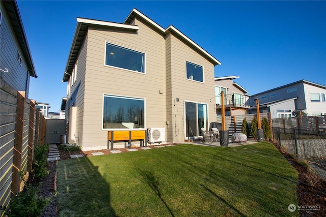 back of house with a yard, a patio area, and ac unit