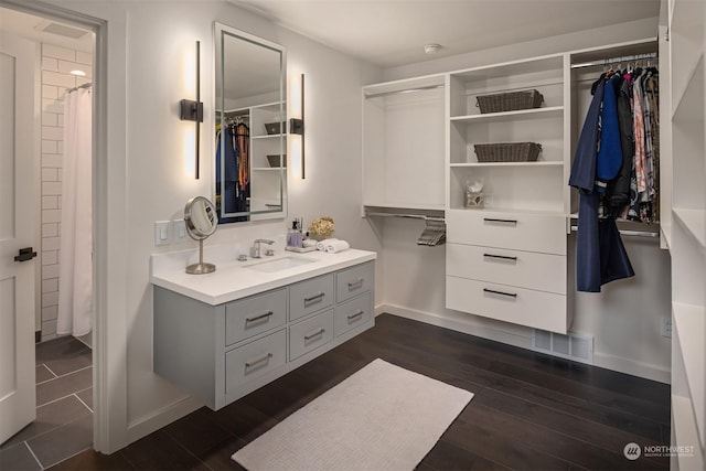 bathroom featuring vanity and wood-type flooring