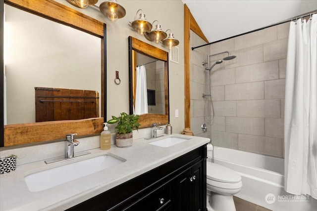 full bathroom featuring vanity, shower / bathtub combination with curtain, and toilet