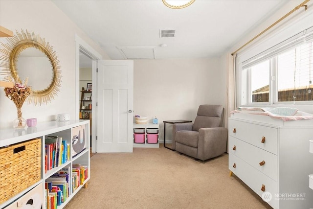 living area with light carpet