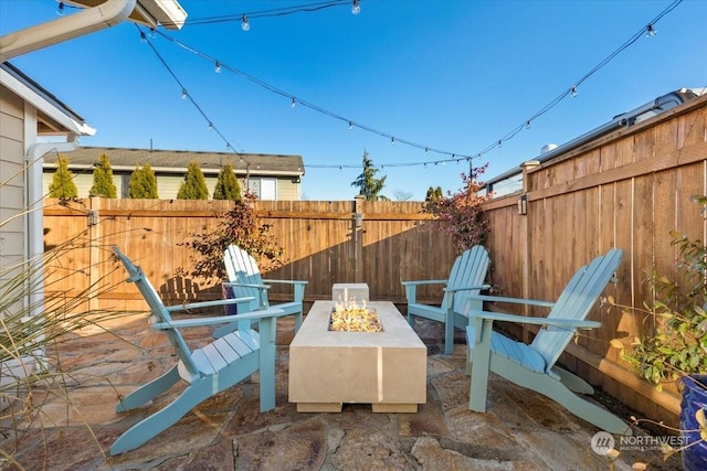 view of patio / terrace featuring a fire pit