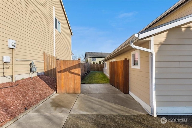 view of side of property featuring a patio