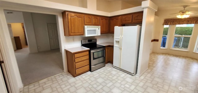 kitchen with ceiling fan and white appliances