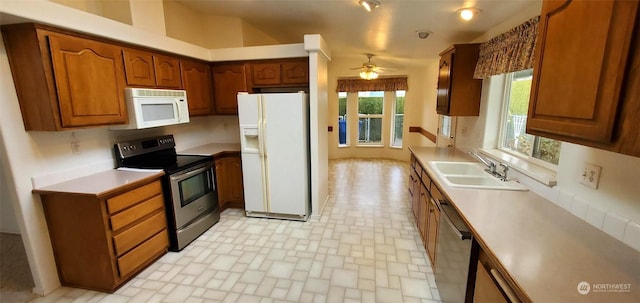 kitchen with ceiling fan, appliances with stainless steel finishes, and sink