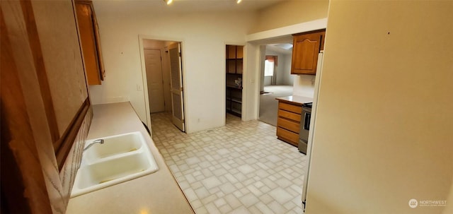 kitchen featuring stainless steel range and sink