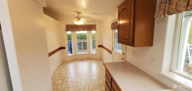 interior space featuring ceiling fan