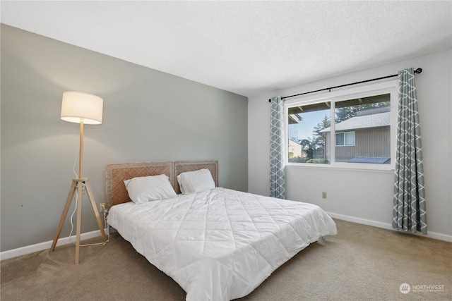 carpeted bedroom with a textured ceiling