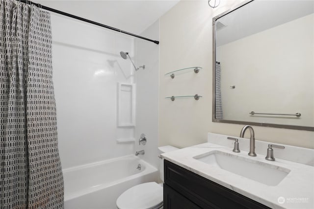 full bathroom with bathtub / shower combination, vanity, and toilet