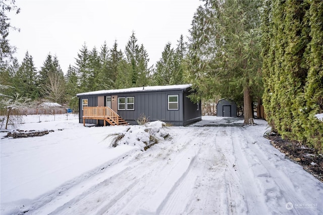 view of front of home featuring a storage shed and a deck